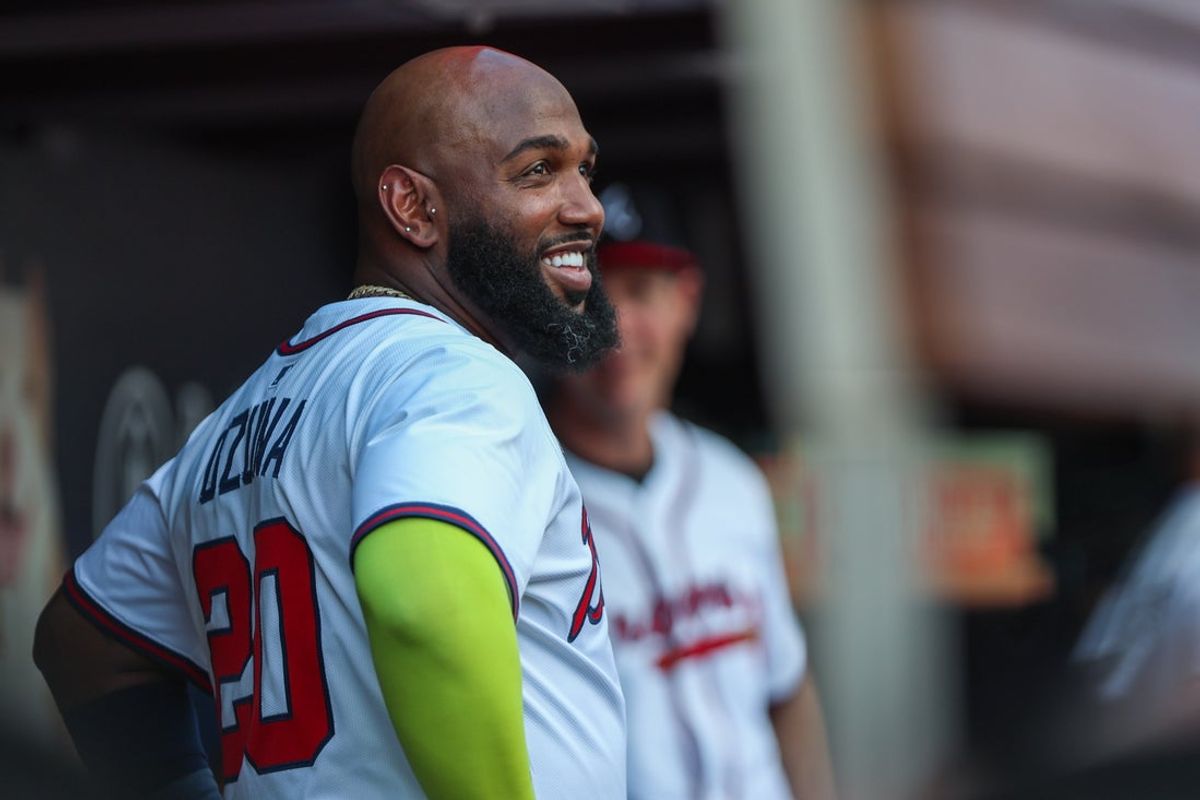 Sep 28, 2025; Cumberland, Georgia, USA; Atlanta Braves designated hitter Marcell Ozuna (20) smiles in the dugout during the game against the Pittsburgh Pirates during the third inning at Truist Park. Mandatory Credit: Jordan Godfree-Imagn Images