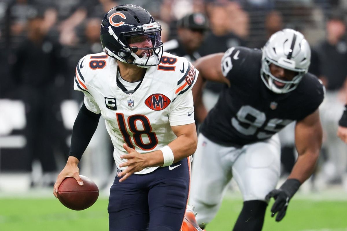Sep 28, 2025; Paradise, Nevada, USA; Chicago Bears quarterback Caleb Williams (18) rolls out of the pocket during the second half against Las Vegas Raiders at Allegiant Stadium. Mandatory Credit: Kiyoshi Mio-Imagn Images