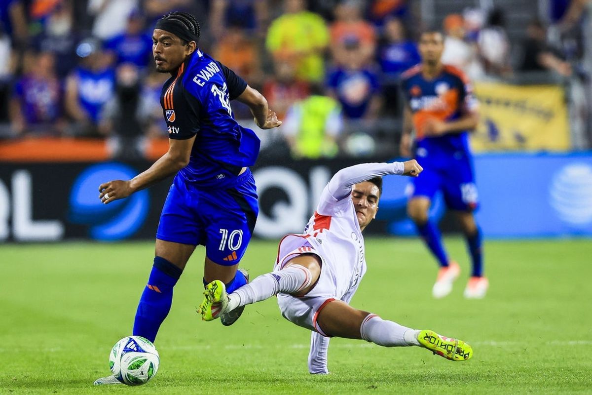 Sep 28, 2025; Cincinnati, Ohio, USA; FC Cincinnati midfielder Evander (10) battles for the ball against Orlando City SC midfielder Eduard Atuesta (20) in the first half at TQL Stadium. Mandatory Credit: Katie Stratman-Imagn Images
