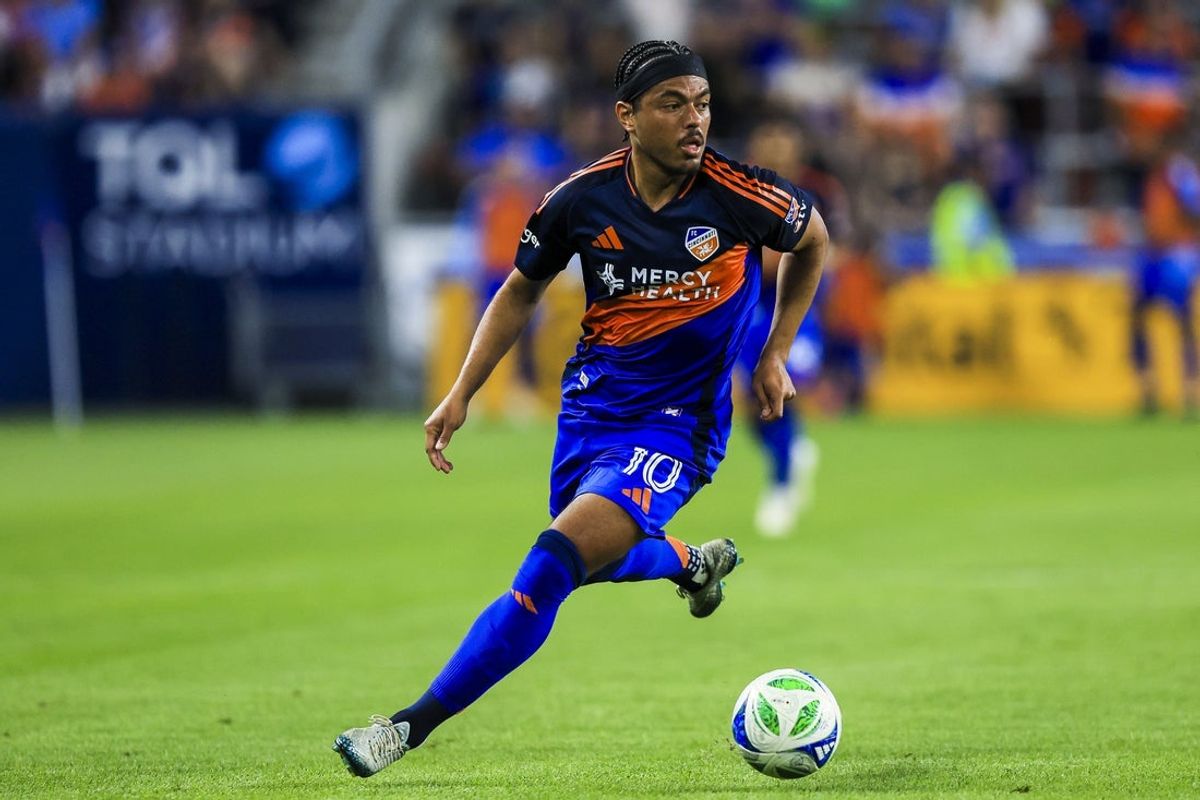 Sep 28, 2025; Cincinnati, Ohio, USA; FC Cincinnati midfielder Evander (10) dribbles against Orlando City SC in the first half at TQL Stadium. Mandatory Credit: Katie Stratman-Imagn Images