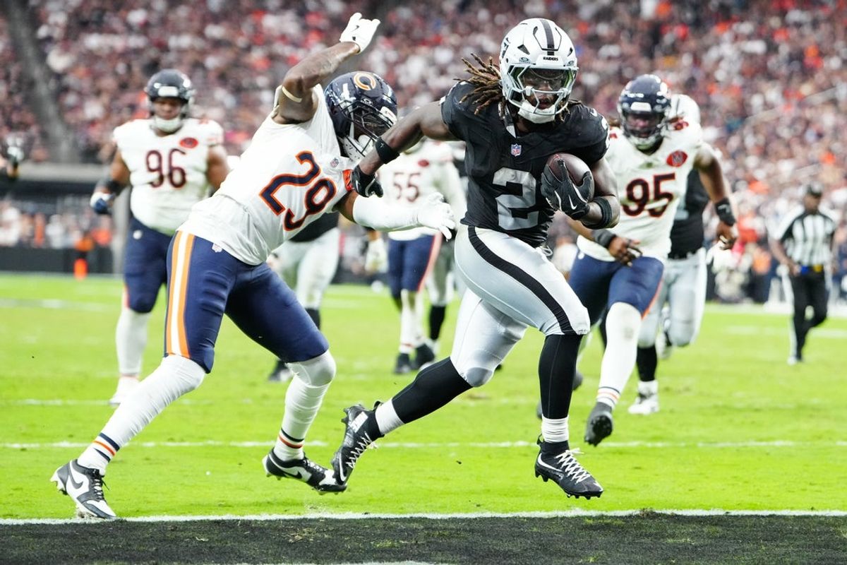 Sep 28, 2025; Paradise, Nevada, USA; Las Vegas Raiders running back Ashton Jeanty (2) runs the ball for a touchdown during the second half against the Chicago Bears at Allegiant Stadium. Mandatory Credit: Stephen R. Sylvanie-Imagn Images