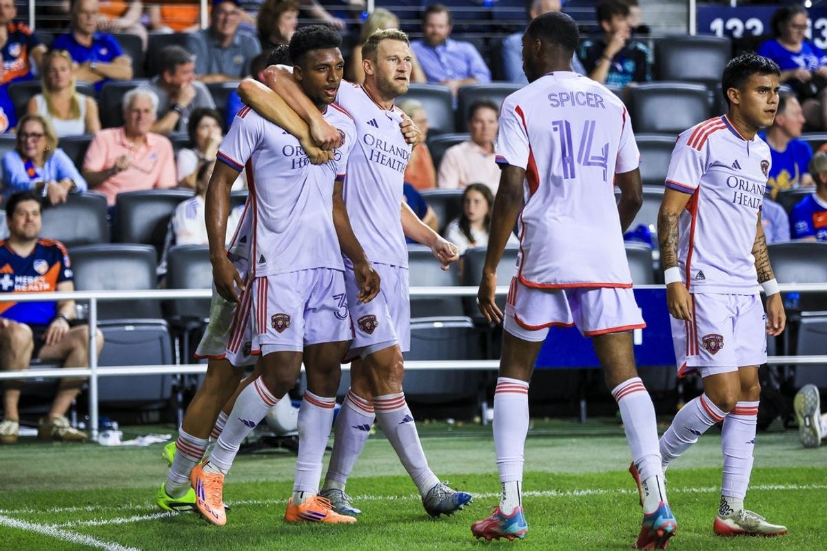 Sep 28, 2025; Cincinnati, Ohio, USA; Orlando City SC defender Alex Freeman (30) reacts with defender Robin Jansson (6) after scoring a goal against FC Cincinnati in the second half at TQL Stadium. Mandatory Credit: Katie Stratman-Imagn Images