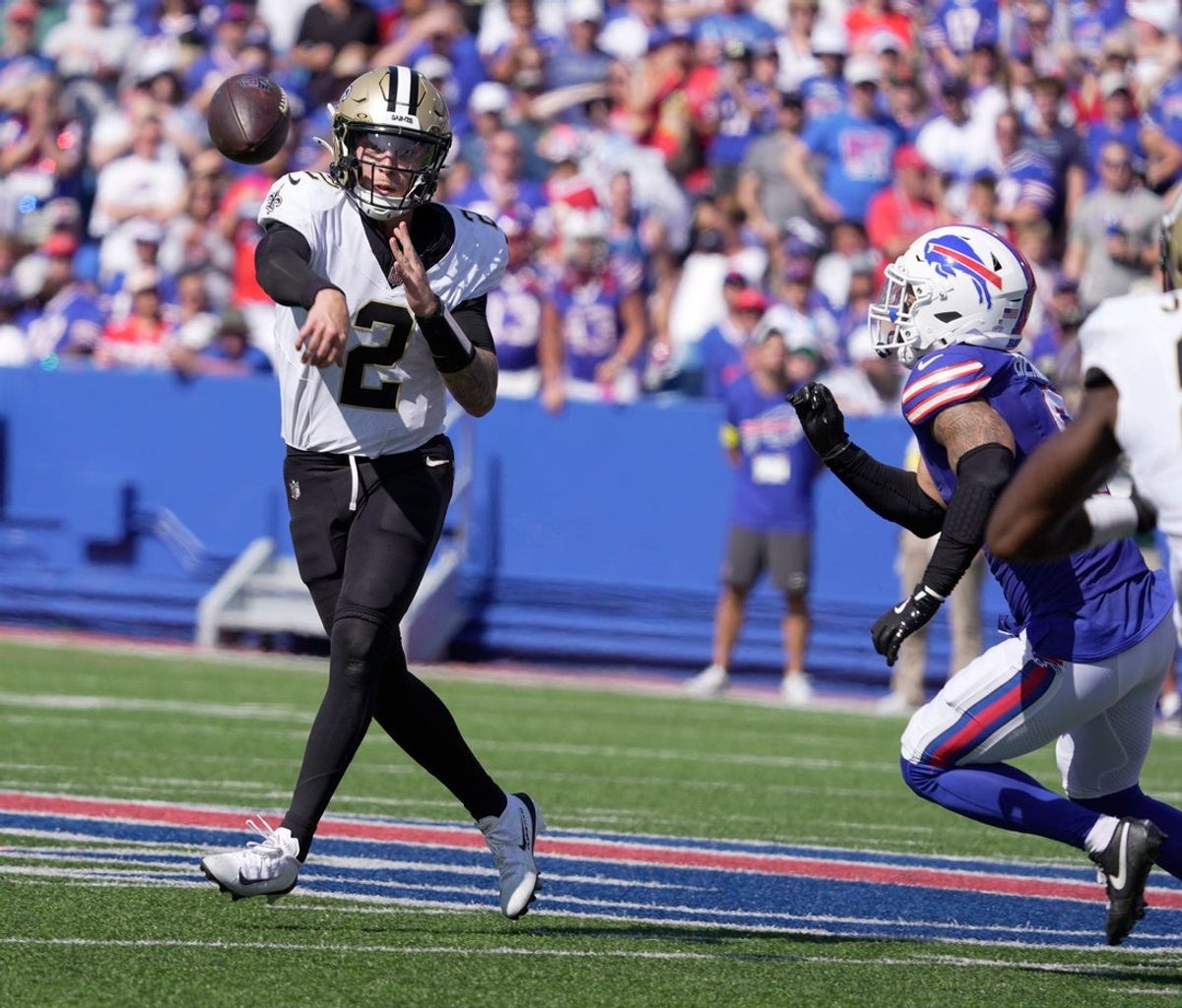 New Orleans quarterback Spencer Rattler tries to get off a pass as he spies Buffalo Bills Terrel Bernard coming for him during first half action of the Bills home game against the New Orleans Saints in Orchard Park on Sept. 28, 2025. The pass was incomplete.