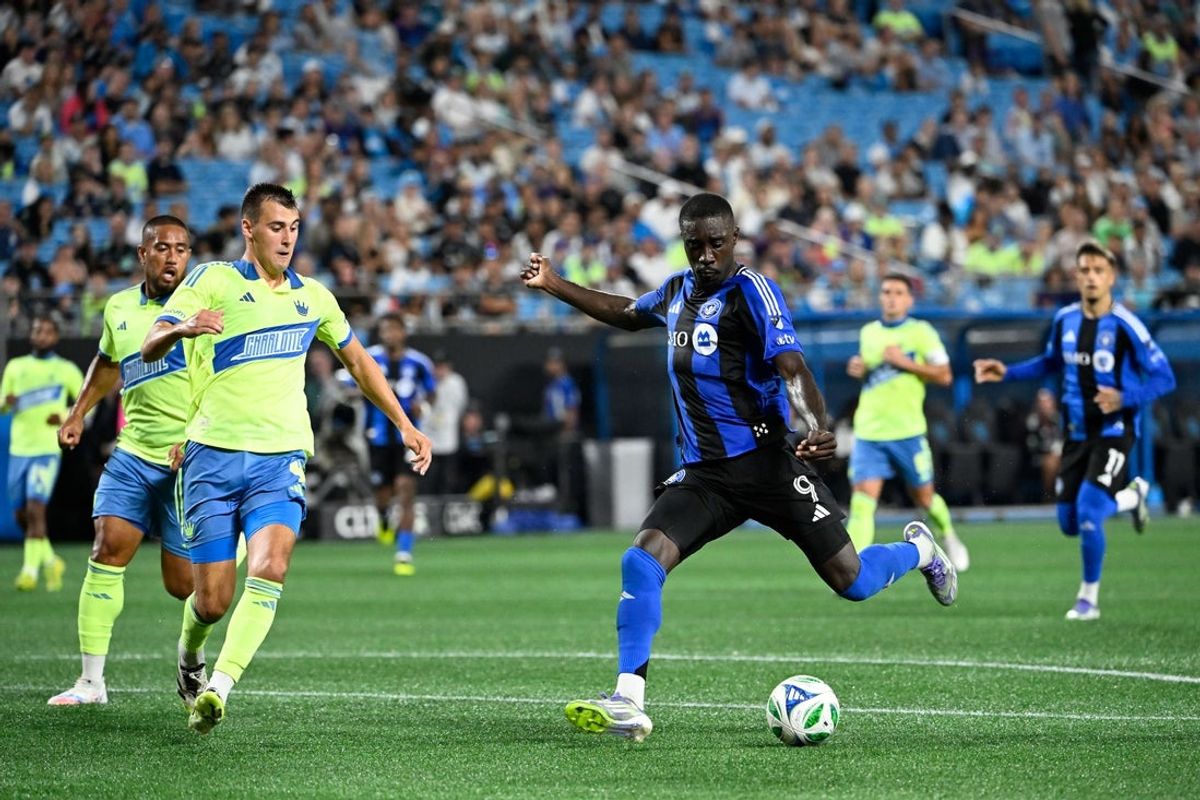 Sep 27, 2025; Charlotte, North Carolina, USA;  CF Montréal forward Prince Osei Owusu (9) shoots as Charlotte FC midfielder Andrew Privett (4) defends in the second half at Bank of America Stadium. Mandatory Credit: Bob Donnan-Imagn Images