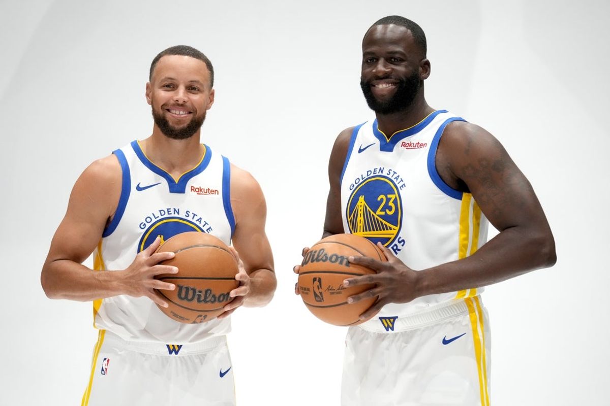 Sep 29, 2025; San Francisco, CA, USA; Golden State Warriors guard Stephen Curry (30) and forward Draymond Green (23) pose for a photo during Media Day at the Chase Center. Mandatory Credit: Cary Edmondson-Imagn Images