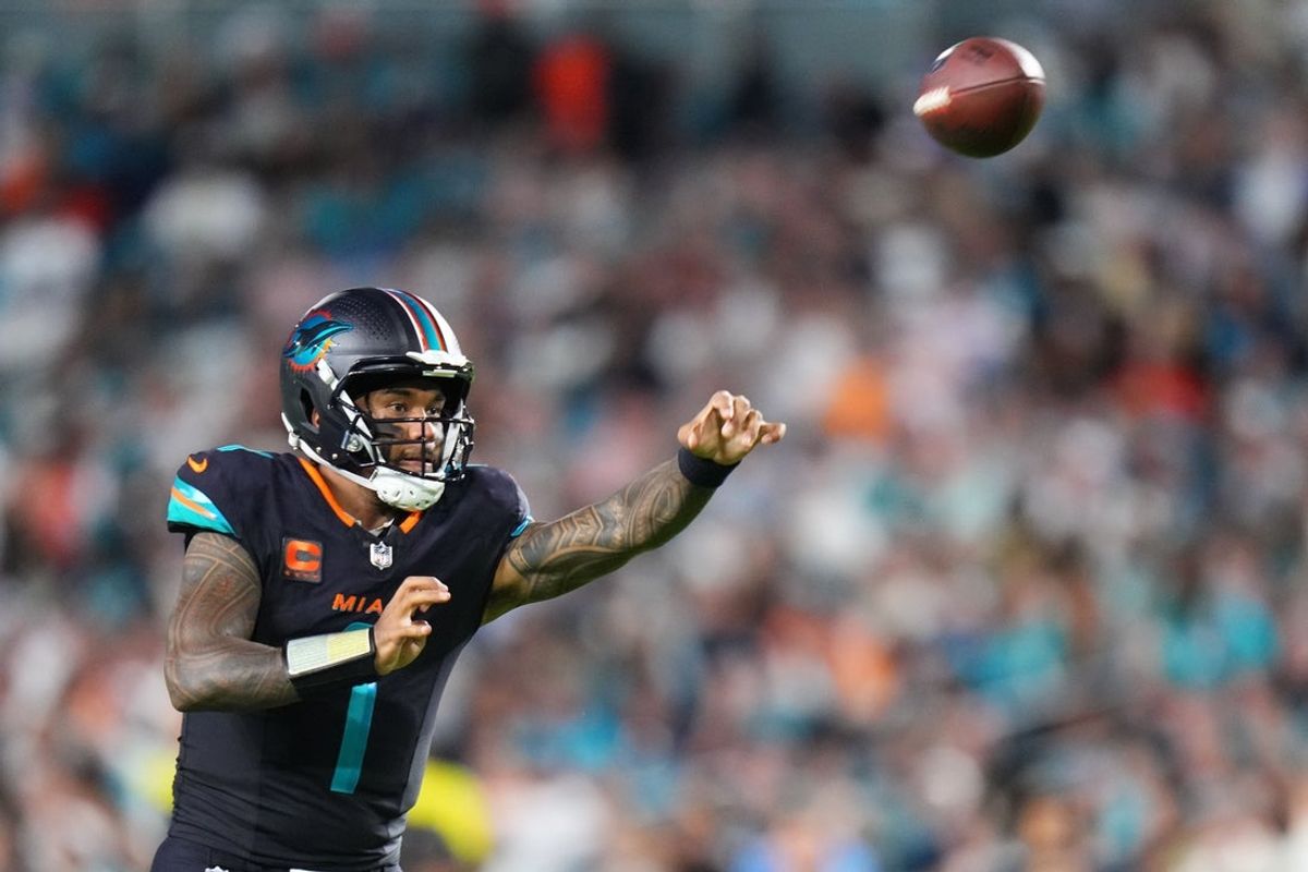 Sep 29, 2025; Miami Gardens, Florida, USA; Miami Dolphins quarterback Tua Tagovailoa (1) throws the ball against the New York Jets during the second half at Hard Rock Stadium. Mandatory Credit: Rich Storry-Imagn Images