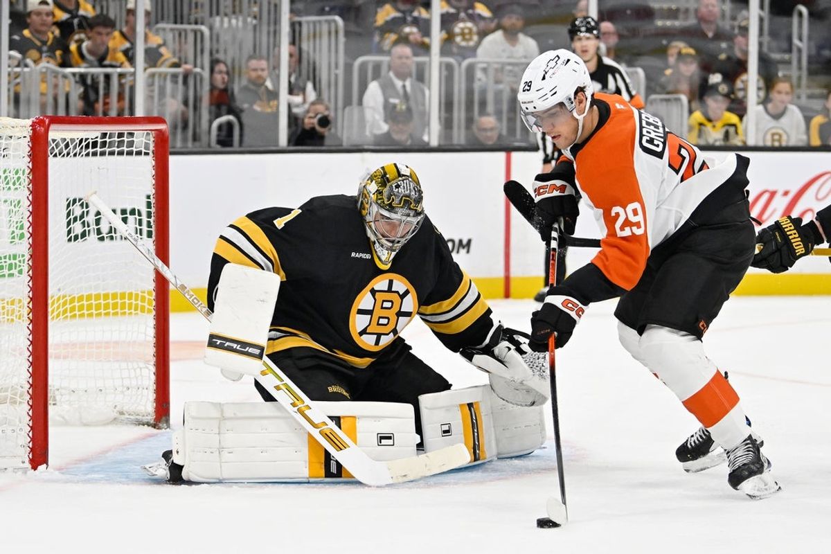 Sep 29, 2025; Boston, Massachusetts, USA;  Boston Bruins goaltender Jeremy Swayman (1) defends against Philadelphia Flyers forward Nikita Grebenkin (29) during overtime at TD Garden. Mandatory Credit: Eric Canha-Imagn Images