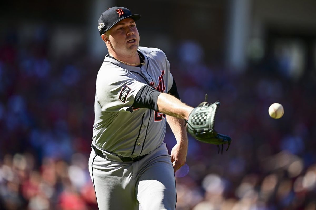 Sep 30, 2025; Cleveland, Ohio, USA; Detroit Tigers pitcher Tarik Skubal (29) flips the ball to first base to get out Cleveland Guardians shortstop Brayan Rocchio (not pictured) in the fourth inning during game one of the Wildcard round for the 2025 MLB playoffs at Progressive Field. Mandatory Credit: David Dermer-Imagn Images
