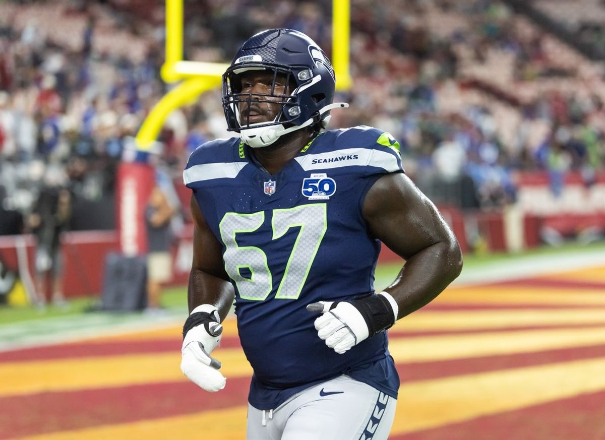 Sep 25, 2025; Glendale, Arizona, USA; Seattle Seahawks tackle Charles Cross (67) against the Arizona Cardinals at State Farm Stadium. Mandatory Credit: Mark J. Rebilas-Imagn Images