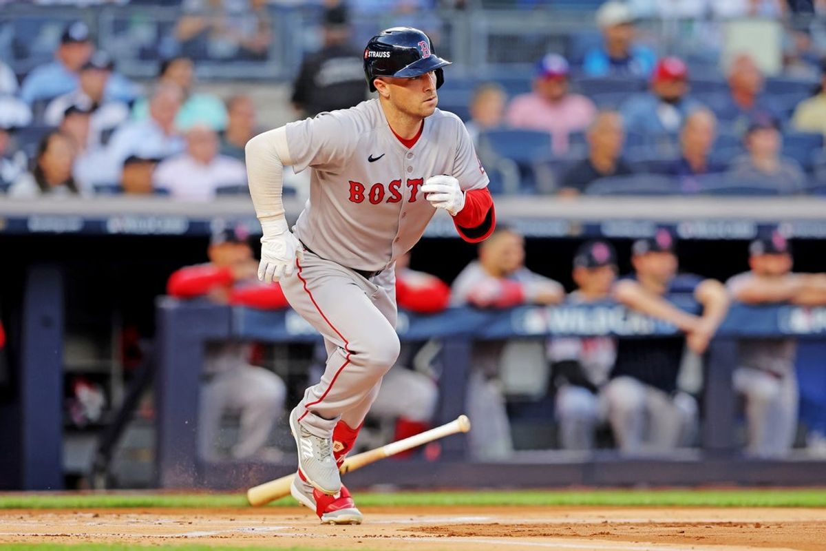 Sep 30, 2025; Bronx, New York, USA; Boston Red Sox third base Alex Bregman (2) hits a single during the first inning against the New York Yankees during game one of the Wildcard round for the 2025 MLB playoffs at Yankee Stadium. Mandatory Credit: Brad Penner-Imagn Images