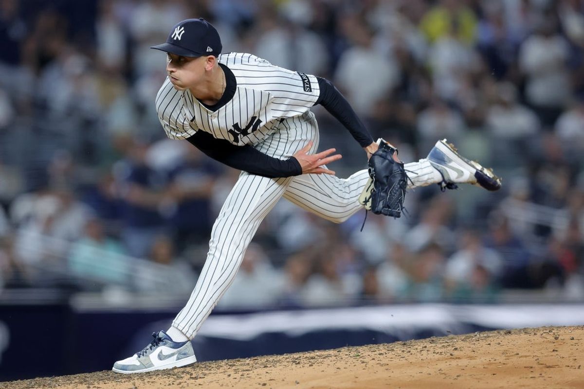 Sep 30, 2025; Bronx, New York, USA; New York Yankees relief pitcher Luke Weaver (30) follows through on a pitch against the Boston Red Sox during the seventh inning of game one of the Wildcard round of the 2025 MLB playoffs at Yankee Stadium. Mandatory Credit: Brad Penner-Imagn Images