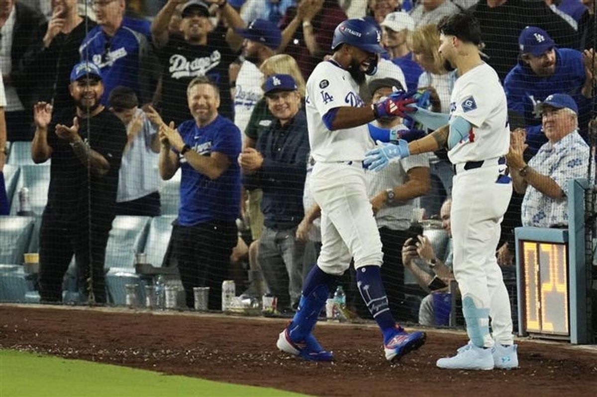 Dodgers outfielder Teoscar Hernández celebrates his fifth inning home run, his second of the game, against the Cincinnati Reds in a National League wild card series game in Los Angeles on Sept. 30.