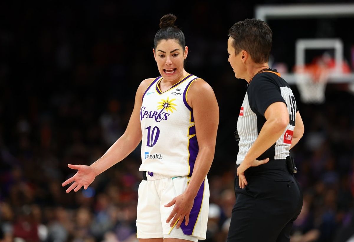 Sep 9, 2025; Phoenix, Arizona, USA; Los Angeles Sparks guard Kelsey Plum (10) talks with WNBA referee Gina Cross against the Phoenix Mercury during a WNBA game at PHX Arena. Mandatory Credit: Mark J. Rebilas-Imagn Images
