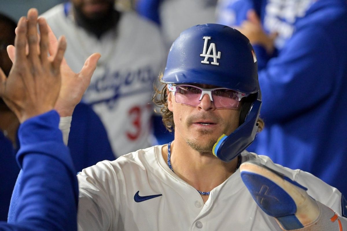 Oct 1, 2025; Los Angeles, California, USA; Los Angeles Dodgers left fielder Enrique Hernandez (8) celebrates with teammates after scoring a run against the Cincinnati Reds in the fourth inning during game two of the Wildcard round for the 2025 MLB playoffs at Dodger Stadium. Mandatory Credit: Jayne Kamin-Oncea-Imagn Images