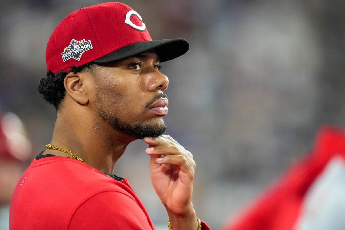 Cincinnati Reds pitcher Hunter Greene (21) watches from the dugout in the eighth inning of the MLB National League Wild Card Game 2 between the Los Angeles Dodgers and the Cincinnati Reds at Dodger Stadium in Los Angeles on Wednesday, Oct. 1, 2025. The Reds were eliminated from the postseason with an 8-4 loss to the reining World Series Champions La Dodgers.