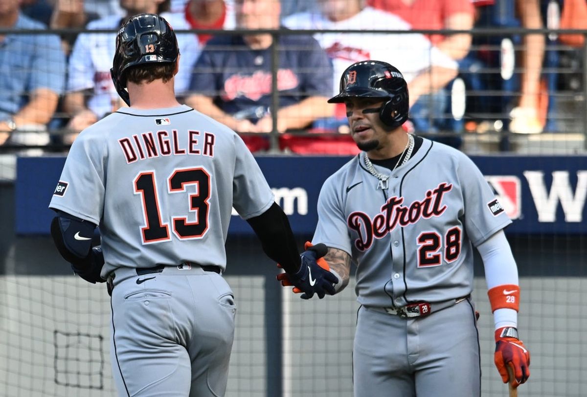 Oct 2, 2025; Cleveland, Ohio, USA; Detroit Tigers catcher Dillon Dingler (13) celebrates with outfielder Javier Baez (28) after hitting a home run in the sixth inning against the Cleveland Guardians during game three of the Wildcard round for the 2025 MLB playoffs at Progressive Field. Mandatory Credit: Ken Blaze-Imagn Images