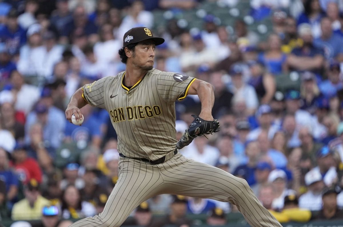 Oct 2, 2025; Chicago, Illinois, USA; San Diego Padres starting pitcher Yu Darvish (11) throws during the first inning against the Chicago Cubs during game three of the Wildcard round for the 2025 MLB playoffs at Wrigley Field. Mandatory Credit: David Banks-Imagn Images