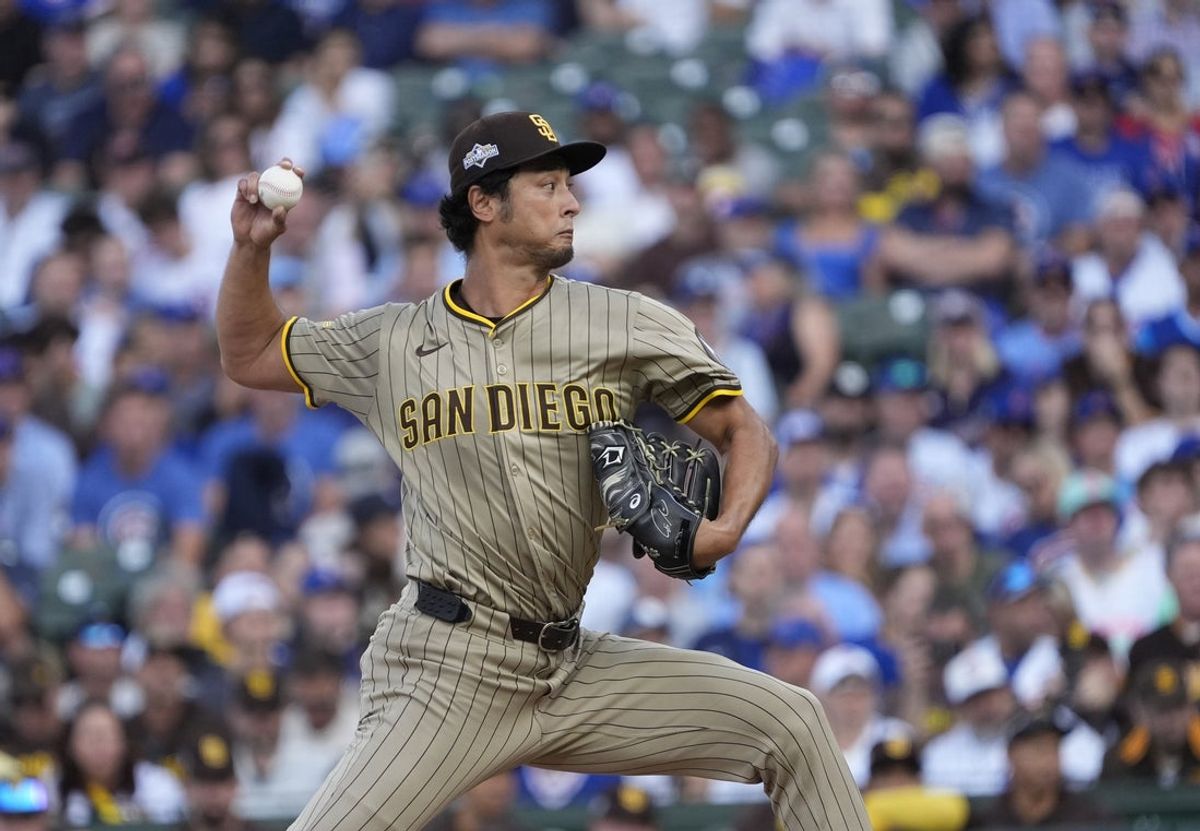 Oct 2, 2025; Chicago, Illinois, USA; San Diego Padres starting pitcher Yu Darvish (11) throws during the first inning against the Chicago Cubs during game three of the Wildcard round for the 2025 MLB playoffs at Wrigley Field. Mandatory Credit: David Banks-Imagn Images
