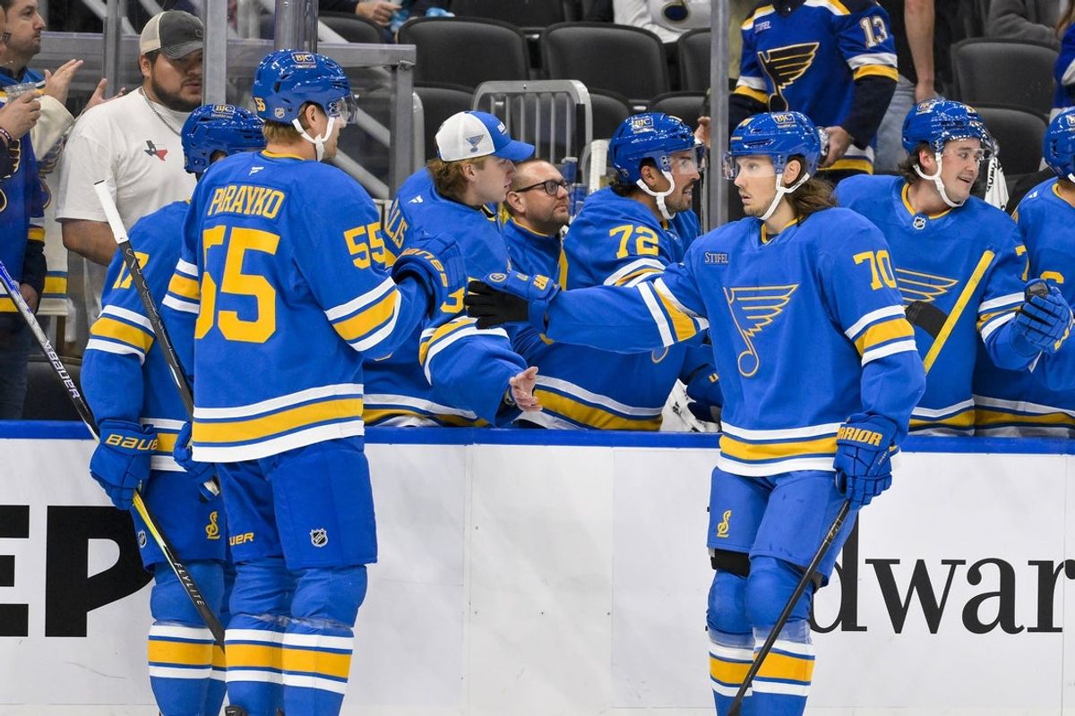Oct 2, 2025; St. Louis, Missouri, USA; St. Louis Blues center Oskar Sundqvist (70) is congratulated by defenseman Colton Parayko (55) after scoring against the Ottawa Senators during the first period at Enterprise Center. Mandatory Credit: Jeff Curry-Imagn Images