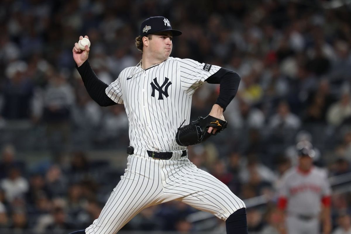 Oct 2, 2025; Bronx, New York, USA; New York Yankees starting pitcher Cam Schlittler (31) throws to the plate in the third inning against the Boston Red Sox during game three of the Wildcard round for the 2025 MLB playoffs at Yankee Stadium. Mandatory Credit: Vincent Carchietta-Imagn Images