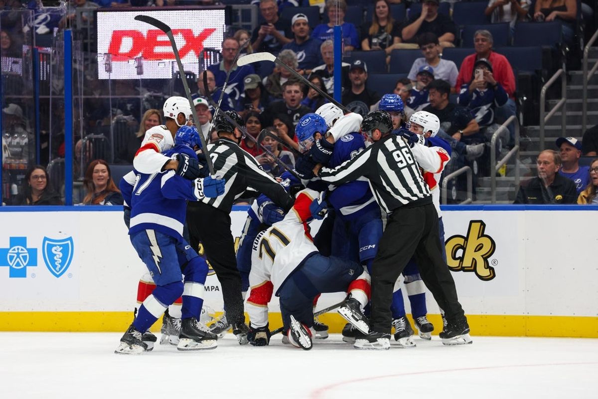 Oct 2, 2025; Tampa, Florida, USA; Florida Panthers center Luke Kunin (71) and Tampa Bay Lightning center Jack Finley (62) lock up in the third period at Benchmark International Arena. Mandatory Credit: Nathan Ray Seebeck-Imagn Images