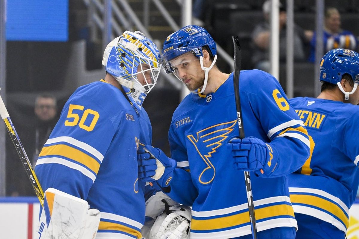 Oct 2, 2025; St. Louis, Missouri, USA; St. Louis Blues goaltender Jordan Binnington (50) celebrates with defenseman Philip Broberg (6) after the Blues defeated the Ottawa Senators at Enterprise Center. Mandatory Credit: Jeff Curry-Imagn Images