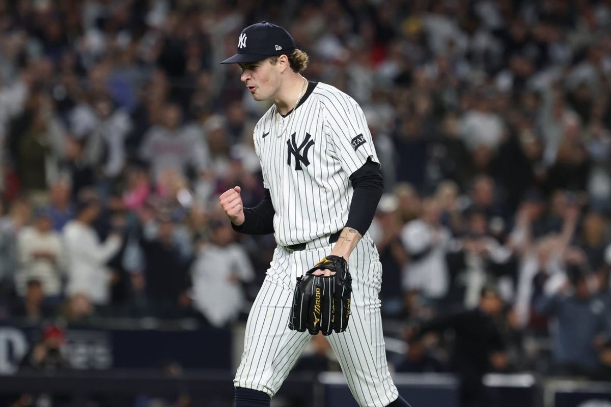 Oct 2, 2025; Bronx, New York, USA; New York Yankees pitcher Cam Schlittler (31) pumps his fist as he leaves the field after pitching the eighth inning against the Boston Red Sox during game three of the Wildcard round for the 2025 MLB playoffs at Yankee Stadium. Mandatory Credit: Vincent Carchietta-Imagn Images