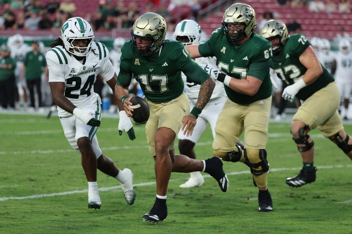 Oct 3, 2025; Tampa, Florida, USA;  South Florida Bulls quarterback Byrum Brown (17) runs with the ball against the Charlotte 49ers during the first quarter at Raymond James Stadium. Mandatory Credit: Kim Klement Neitzel-Imagn Images