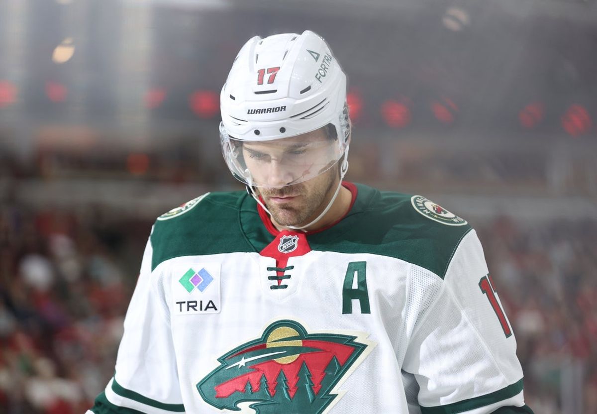 Oct 3, 2025; Chicago, Illinois, USA; Minnesota Wild left wing Marcus Foligno (17) skates down ice during the first period against the Chicago Blackhawks at United Center. Mandatory Credit: Talia Sprague-Imagn Images