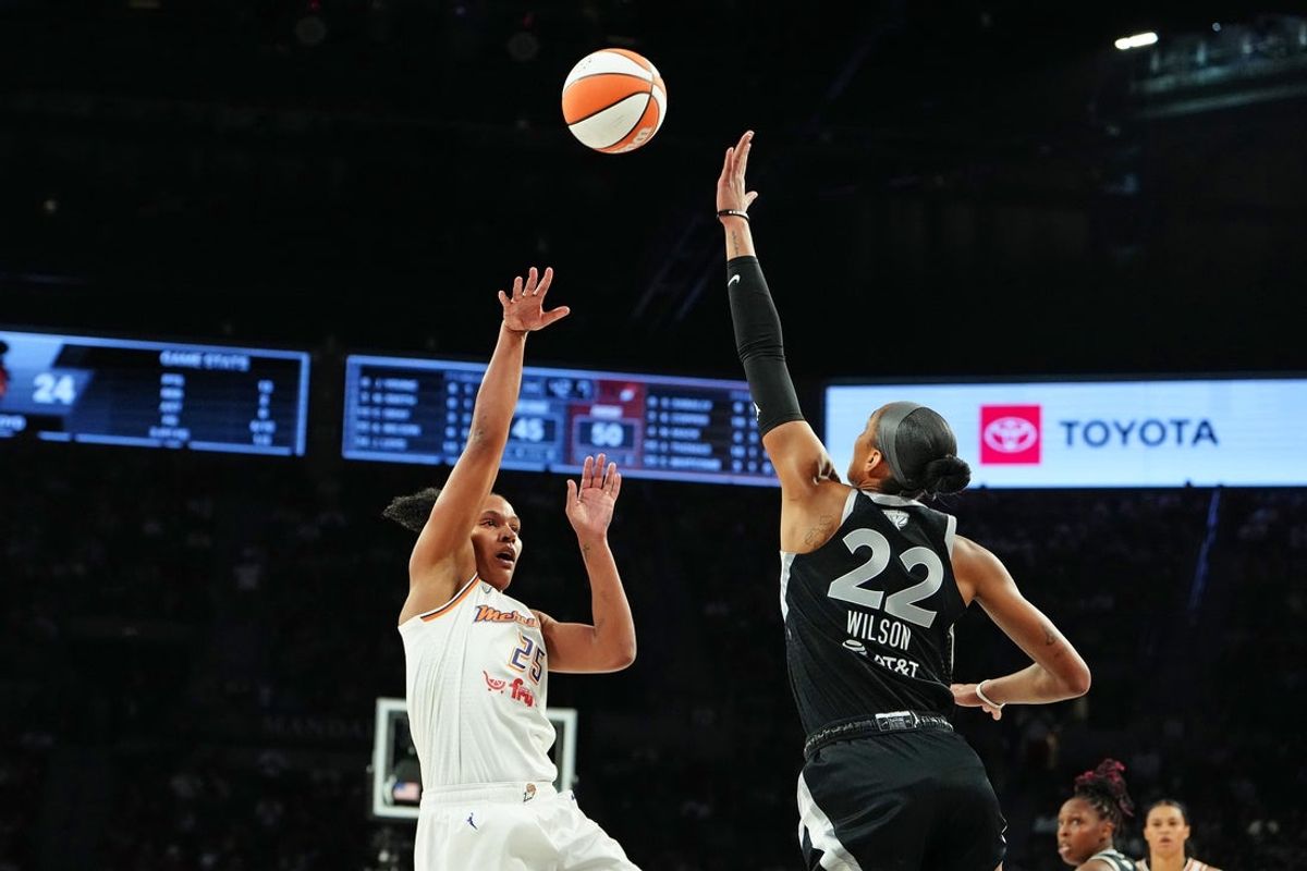 Oct 3, 2025; Las Vegas, Nevada, USA; Phoenix Mercury forward Alyssa Thomas (25) shoots against Las Vegas Aces center A'ja Wilson (22) during the second quarter of game one of the 2025 WNBA Finals at Michelob Ultra Arena. Mandatory Credit: Stephen R. Sylvanie-Imagn Images