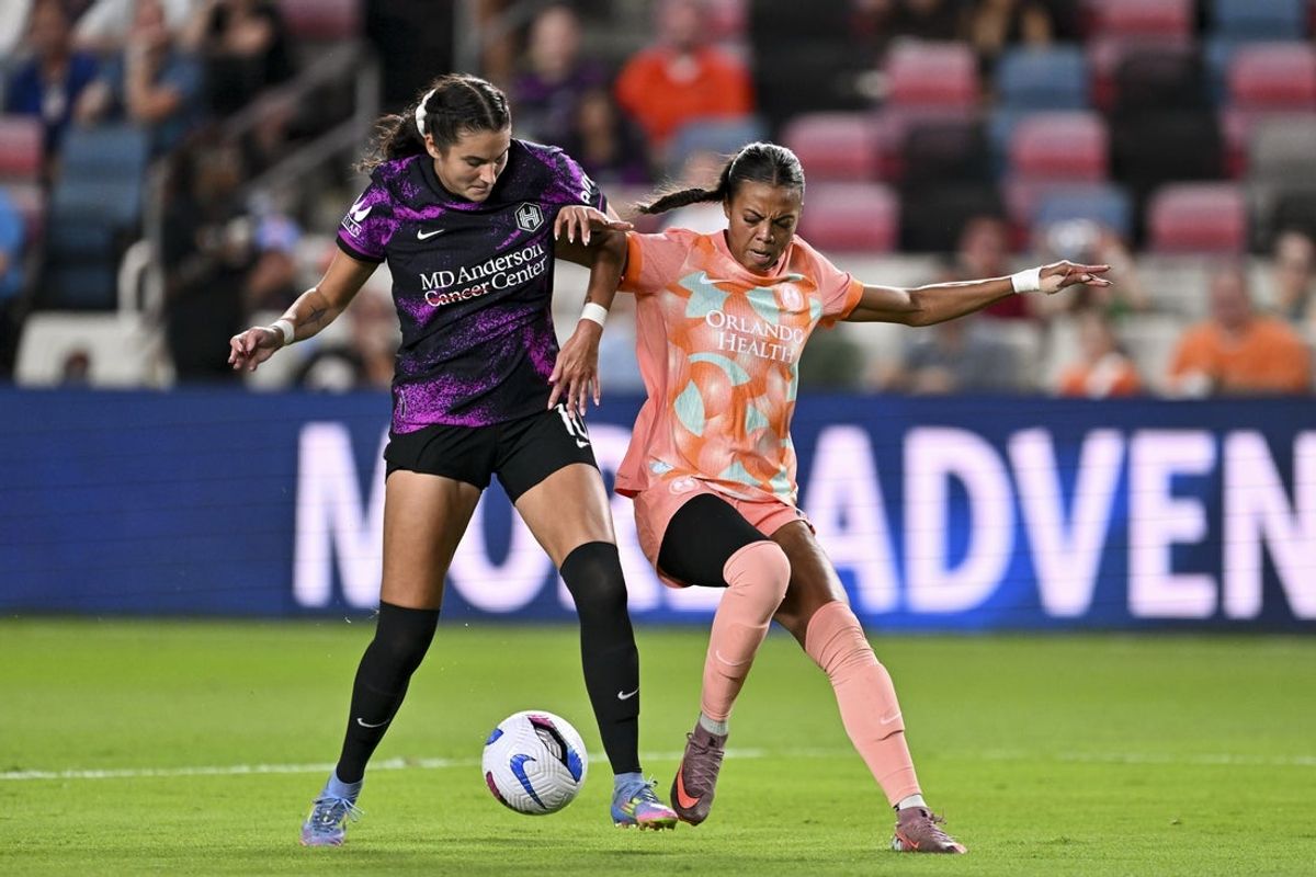 Oct 3, 2025; Houston, Texas, USA; Orlando Pride forward Ally Watt (11) and Houston Dash defender Malia Berkely (10) battles for possession during the first half at Shell Energy Stadium. Mandatory Credit: Maria Lysaker-Imagn Images