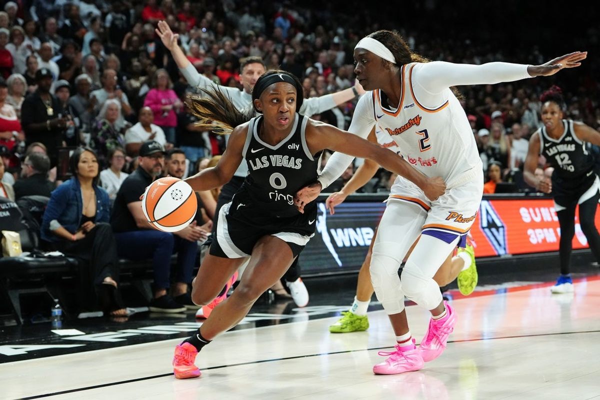 Oct 3, 2025; Las Vegas, Nevada, USA; Las Vegas Aces guard Jackie Young (0) dribbles against Phoenix Mercury guard Kahleah Copper (2) during the fourth quarter of game one of the 2025 WNBA Finals at Michelob Ultra Arena. Mandatory Credit: Stephen R. Sylvanie-Imagn Images