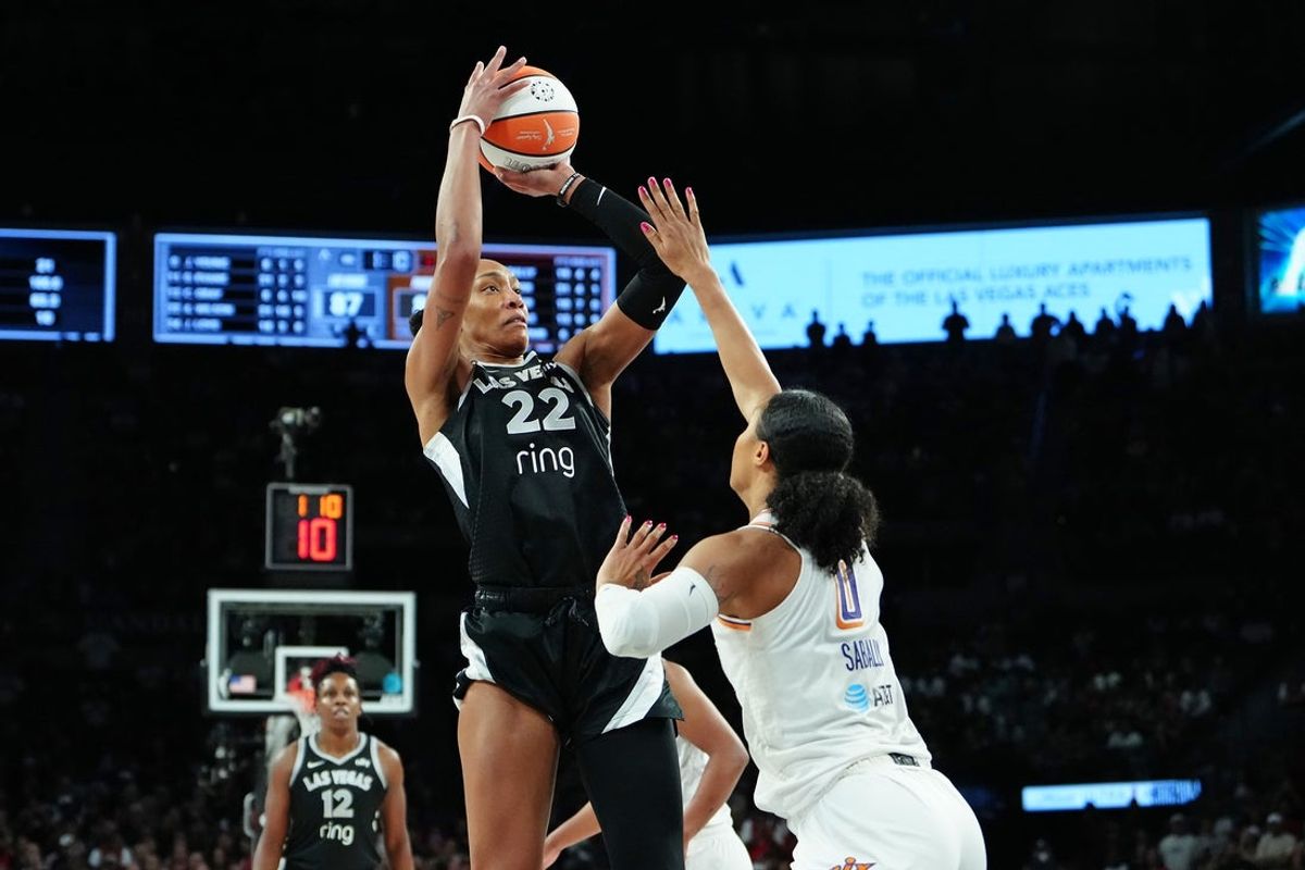 Oct 3, 2025; Las Vegas, Nevada, USA; Las Vegas Aces center A'ja Wilson (22) shoots against Phoenix Mercury forward Satou Sabally (0) during the fourth quarter of game one of the 2025 WNBA Finals at Michelob Ultra Arena. Mandatory Credit: Stephen R. Sylvanie-Imagn Images