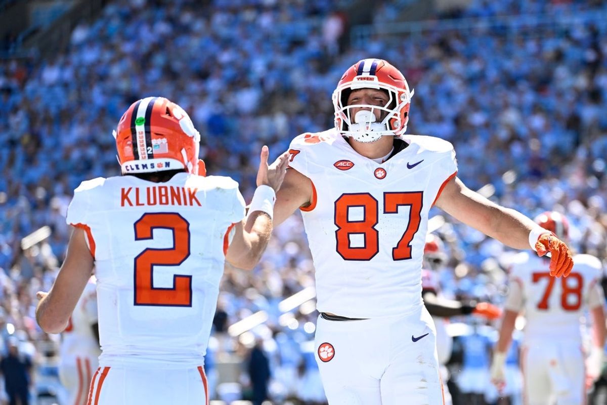 Oct 4, 2025; Chapel Hill, North Carolina, USA;  Clemson Tigers tight end Christian Bentancur (87) celebrates with quarterback Cade Klubnik (2) after scoring a touchdown the second quarter at Kenan Stadium. Mandatory Credit: Bob Donnan-Imagn Images