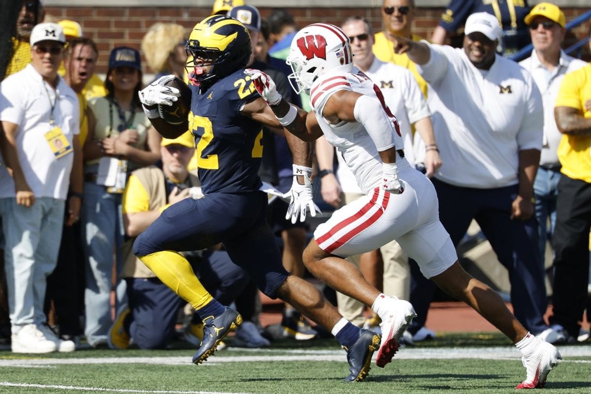 Oct 4, 2025; Ann Arbor, Michigan, USA;  Michigan Wolverines running back Justice Haynes (22) rushes in the first half against the Wisconsin Badgers at Michigan Stadium. Mandatory Credit: Rick Osentoski-Imagn Images
