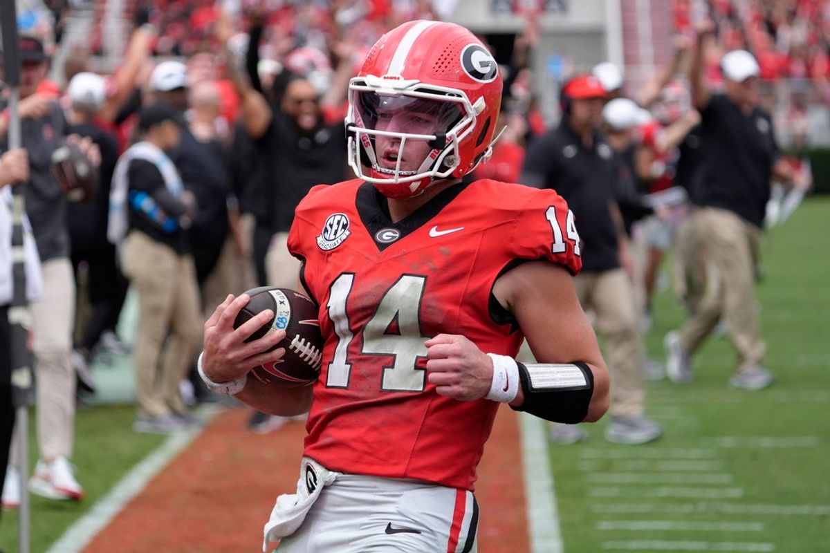 Georgia quarterback Gunner Stockton (14) runs in for another touchdown during the first half of a NCAA college football game against Kentucky in Athens, Ga., on Saturday, October 4, 2025.