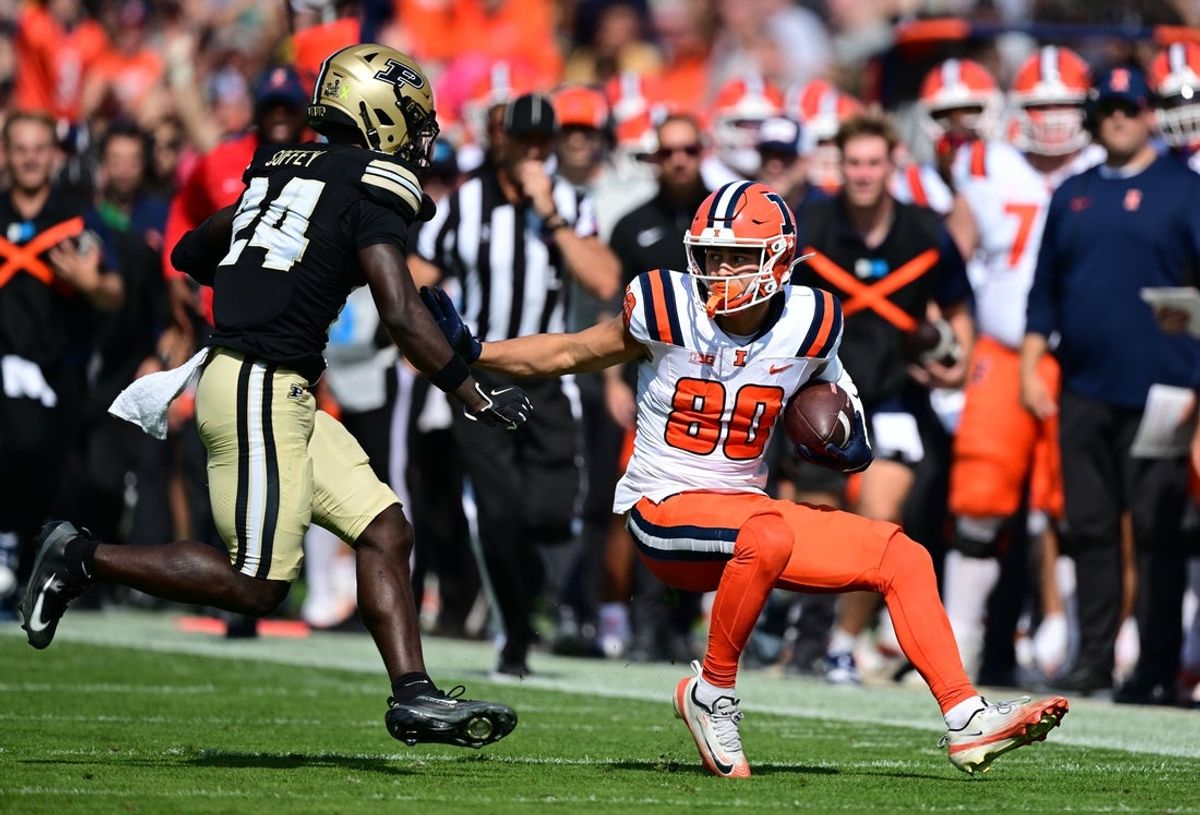 Oct 4, 2025; West Lafayette, Indiana, USA; Illinois Fighting Illini wide receiver Hank Beatty (80) runs into Purdue Boilermakers defensive back An'Darius Coffey (24) during the second quarter at Ross-Ade Stadium. Mandatory Credit: Marc Lebryk-Imagn Images