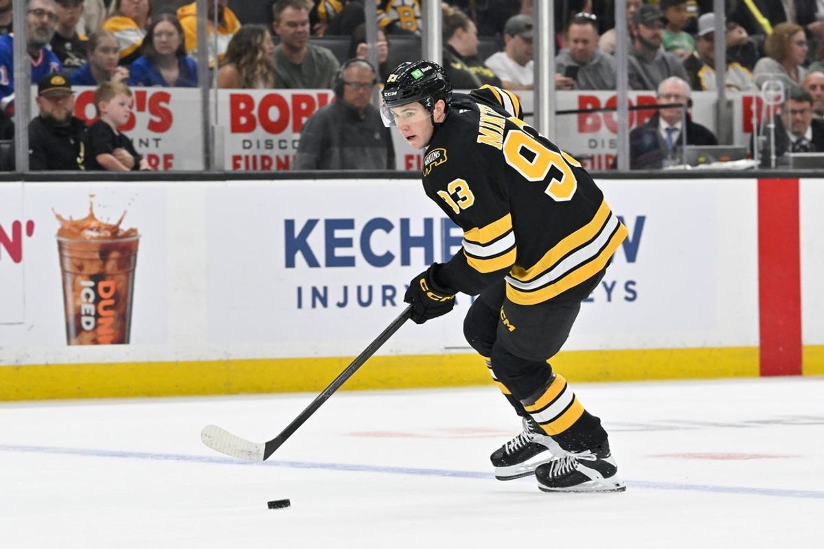 Oct 4, 2025; Boston, Massachusetts, USA; Boston Bruins center Fraser Minten (93) controls the puck against the New York Rangers during the first period at TD Garden. Mandatory Credit: Eric Canha-Imagn Images