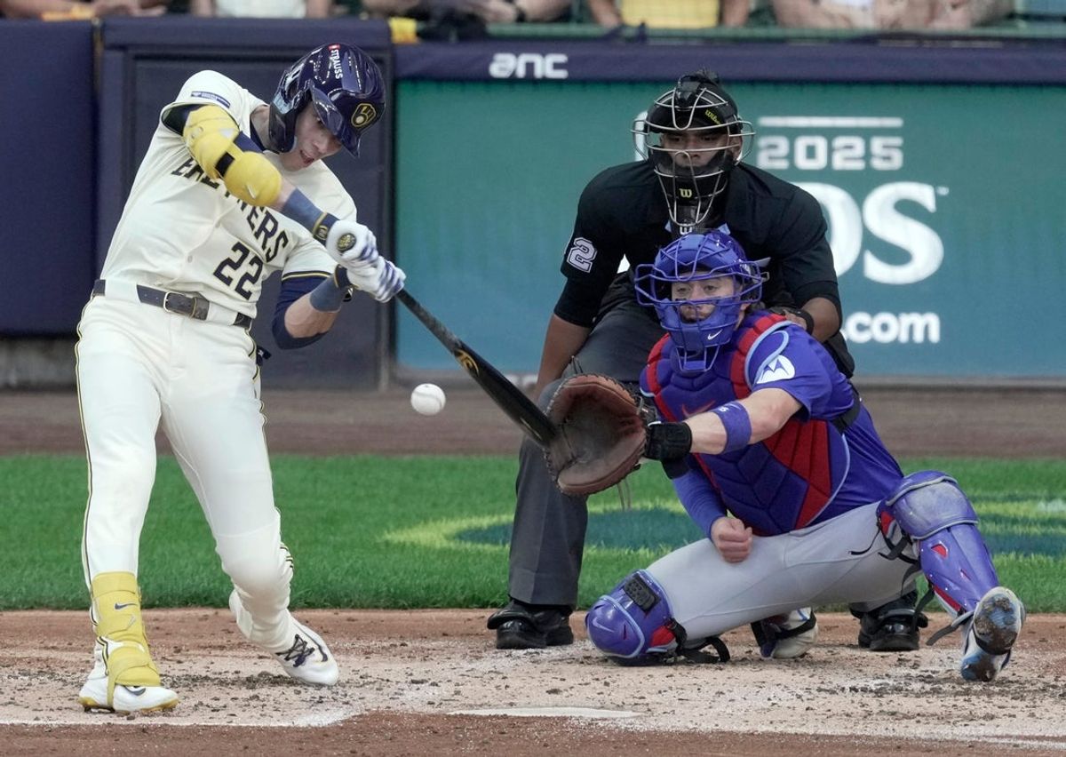Milwaukee Brewers left fielder Christian Yelich (22) hits a single during the second inning of their National League Division Series game against the Chicago Cubs Saturday, October 4, 2025 at American Family Field in Milwaukee, Wisconsin.