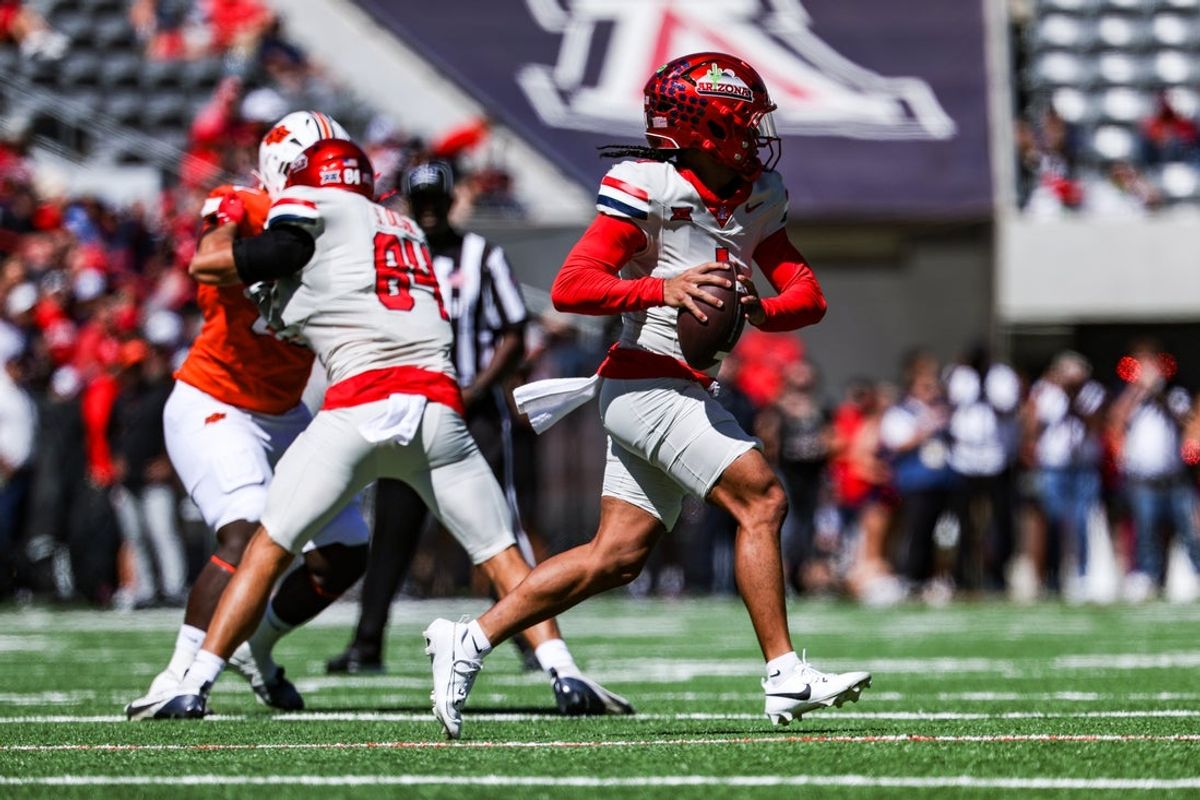 Oct 4, 2025; Tucson, Arizona, USA; Arizona Wildcats quarterback Noah Fifita (1) looks to pass the ball against the Oklahoma State Cowboys during the first quarter at Arizona Stadium. Mandatory Credit: Aryanna Frank-Imagn Images