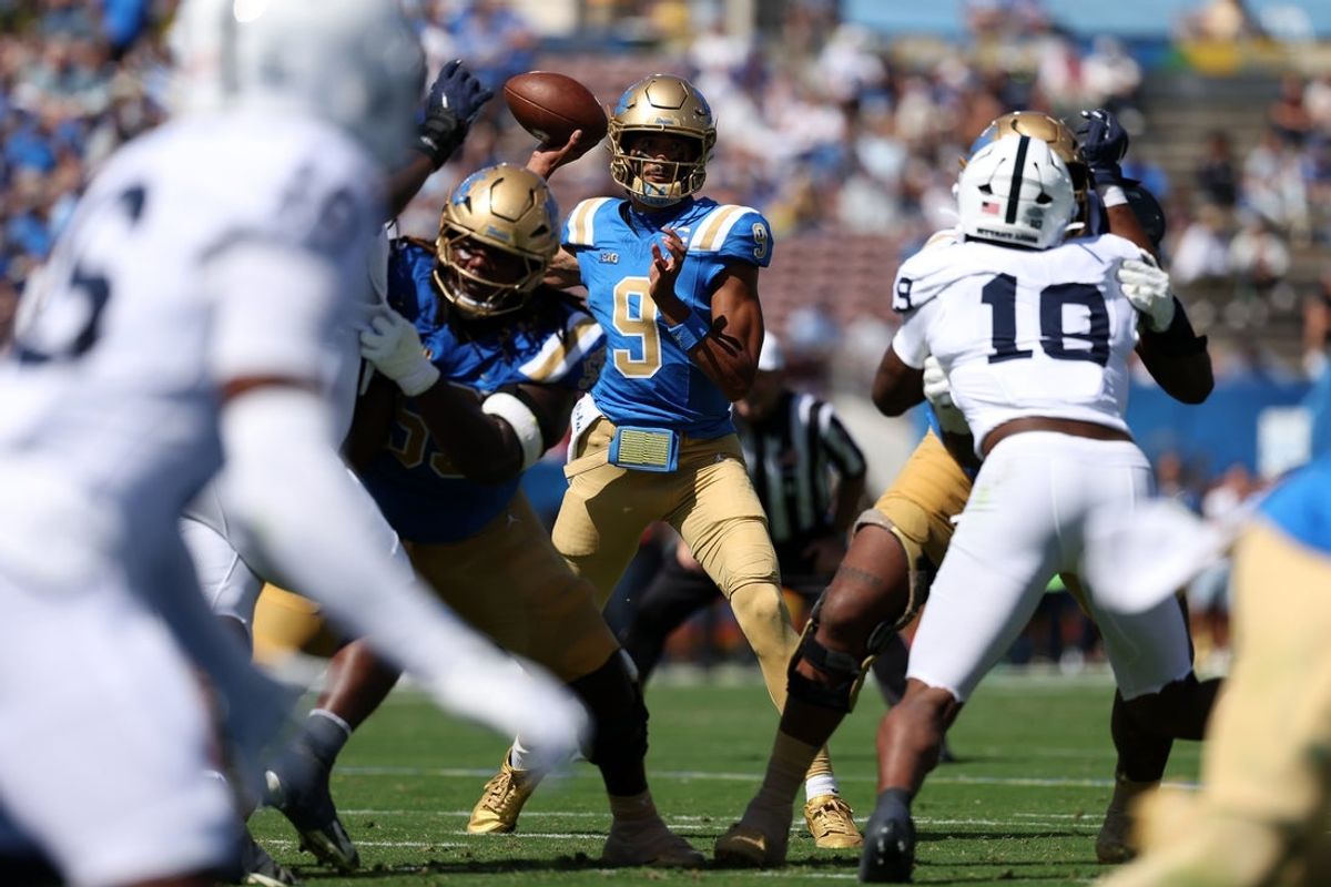 Oct 4, 2025; Pasadena, California, USA;  UCLA Bruins quarterback Nico Iamaleava (9) looks to pass during the first quarter against the Penn State Nittany Lions at Rose Bowl. Mandatory Credit: Kiyoshi Mio-Imagn Images