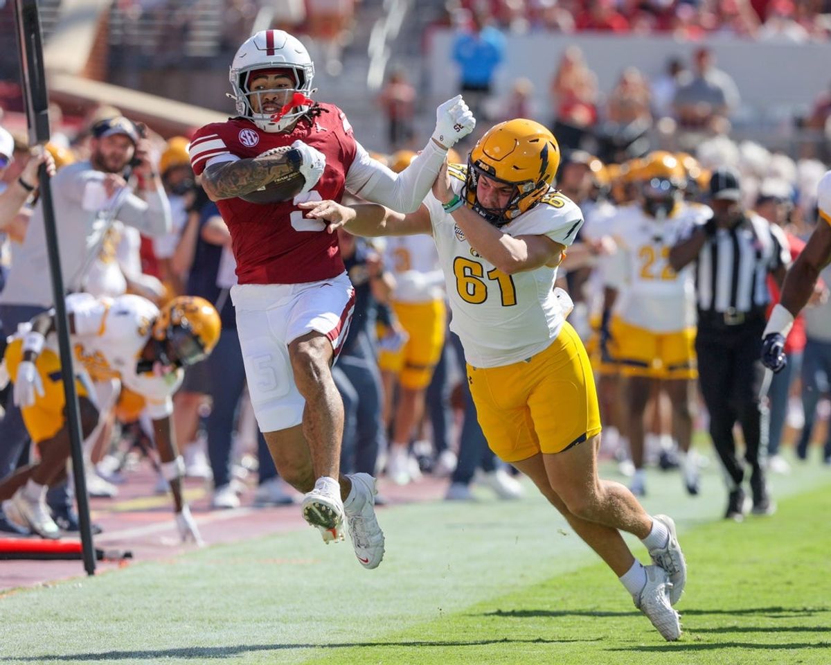 Oklahoma's Isaiah Sategna III (5) returns a punt for a long gain as Kent State punter Charlie Durkin (61) defends during the first half of an NCAA football game between the Oklahoma Sooners (OU) and Kent State Golden Flashes at Gaylord Family - Oklahoma Memorial Stadium in Norman, Okla., Saturday, Oct. 4, 2025.