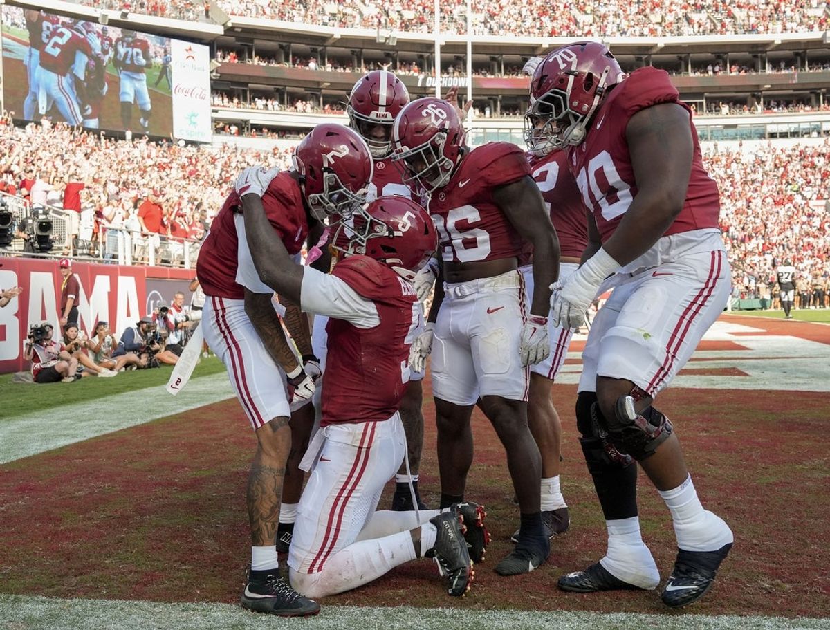 Oct 4, 2025; Tuscaloosa, Alabama, USA;  Alabama wide receiver Germie Bernard (5) celebrates with teammates after scoring a touchdown against Vanderbilt in the moments before halftime at Saban Field at Bryant-Denny Stadium. Mandatory Credit: Gary Cosby Jr.-USA TODAY Network via Imagn Images