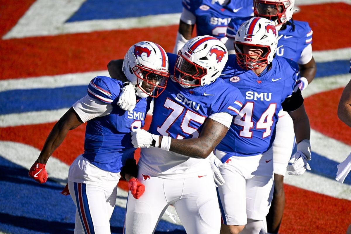 Oct 4, 2025; Dallas, Texas, USA; SMU Mustangs wide receiver Jordan Hudson (2) and offensive lineman Dramodd Odoms (75) and tight end Stone Eby (44) celebrate a touchdown against the Syracuse Orange during the second half at Gerald J. Ford Stadium. Mandatory Credit: Jerome Miron-Imagn Images