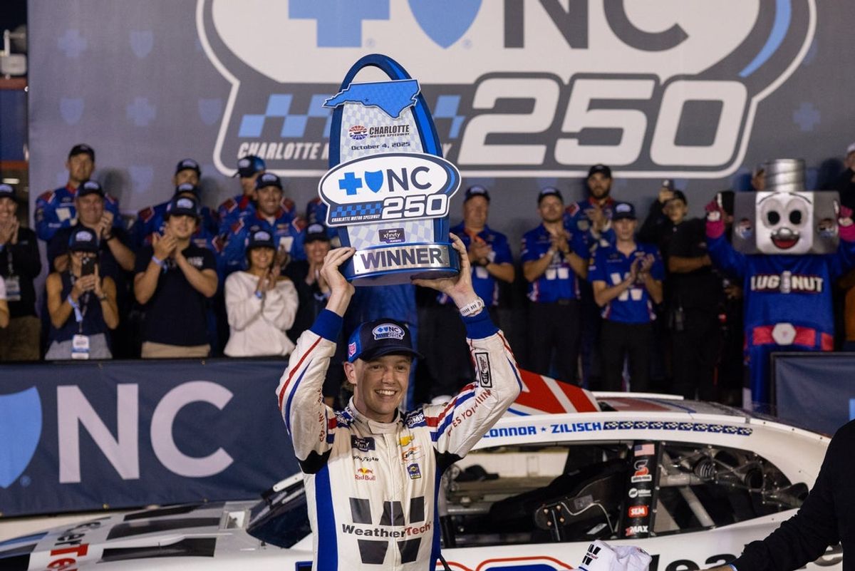 Oct 4, 2025; Concord, North Carolina, USA; NASCAR Xfinity Series driver Connor Zilisch (88) celebrates in Victory Lane after winning at Charlotte Motor Speedway Road Course. Mandatory Credit: Scott Kinser-Imagn Images