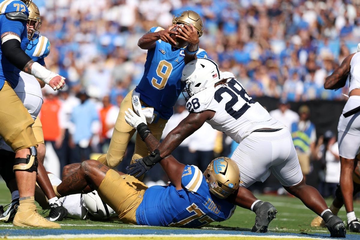 Oct 4, 2025; Pasadena, California, USA;  UCLA Bruins quarterback Nico Iamaleava (9) scores a touchdown on 1 yard run during the third quarter against the Penn State Nittany Lions at Rose Bowl. Mandatory Credit: Kiyoshi Mio-Imagn Images