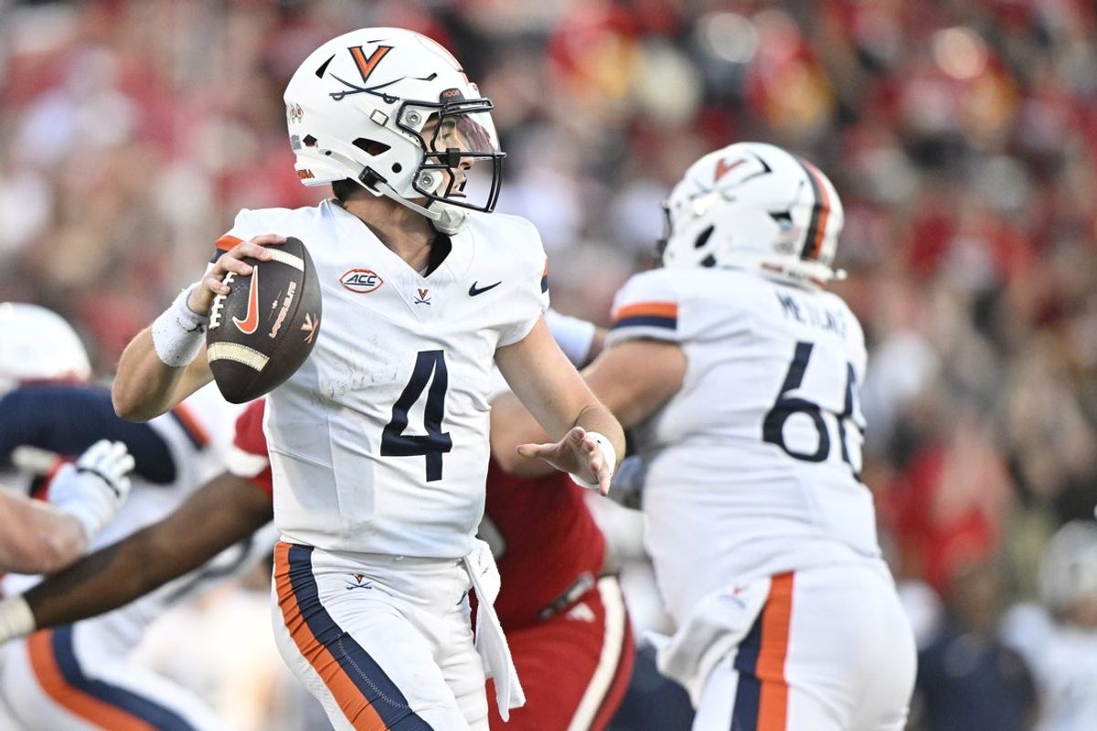 Oct 4, 2025; Louisville, Kentucky, USA; Virginia Cavaliers quarterback Chandler Morris (4) looks to pass against the Louisville Cardinals during the second half at L&N Federal Credit Union Stadium. Virginia defeated Louisville 30-27. Mandatory Credit: Jamie Rhodes-Imagn Images