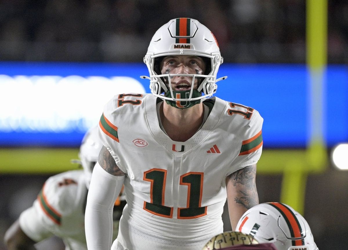Oct 4, 2025; Tallahassee, Florida, USA; Miami Hurricanes quarterback Carson Beck (11) at the line during the first half against the Florida State Seminoles at Doak S. Campbell Stadium. Mandatory Credit: Melina Myers-Imagn Images