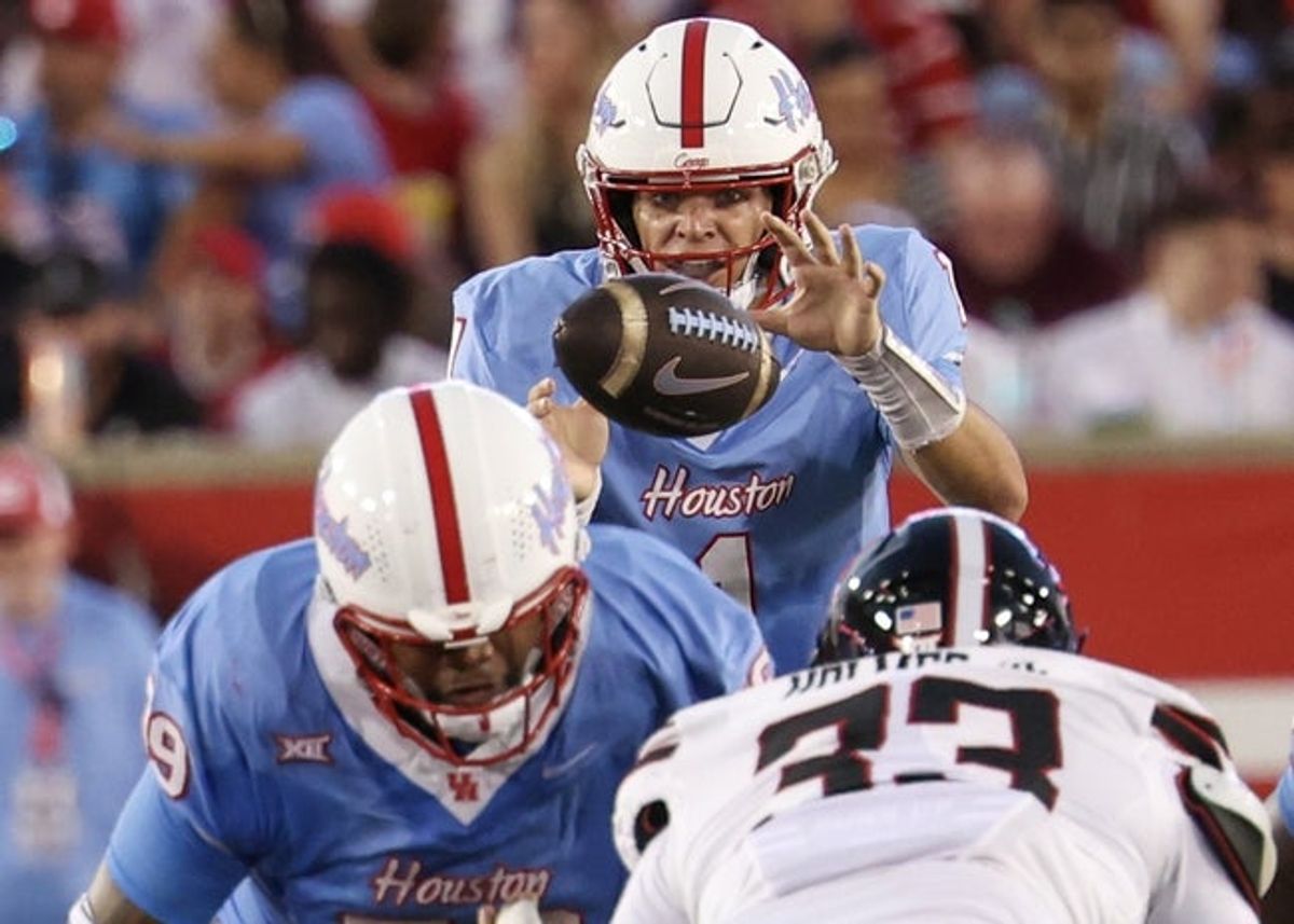 Oct 4, 2025; Houston, Texas, USA; Houston Cougars quarterback Conner Weigman (1) has the ball hiked to him against the Texas Tech Raiders in the first half at TDECU Stadium. Mandatory Credit: Thomas Shea-Imagn Images