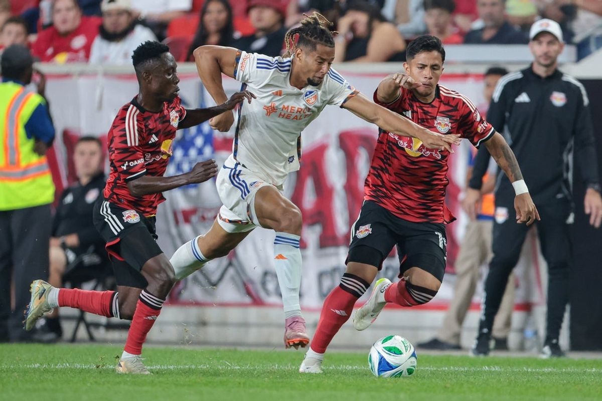 Oct 4, 2025; Harrison, New Jersey, USA; FC Cincinnati forward Ayoub Jabbari (26) plays the ball against New York Red Bulls forward Julian Hall (16) and midfielder Wiki Carmona (19) during the second half at Sports Illustrated Stadium. Mandatory Credit: Vincent Carchietta-Imagn Images